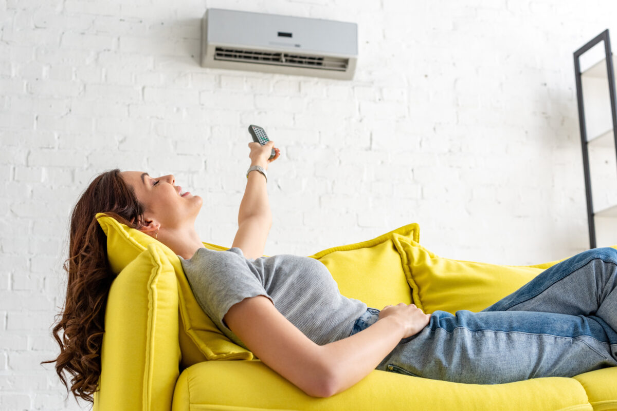 Woman relaxing and enjoying new AC unit